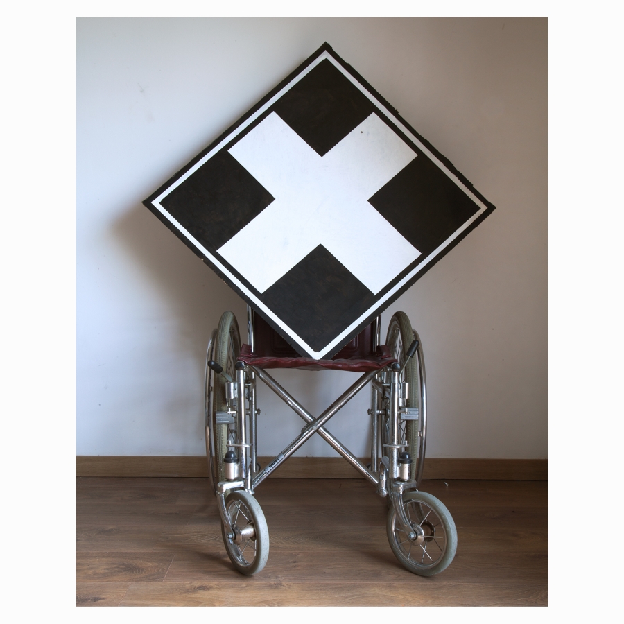 Wheelchair with White Cross