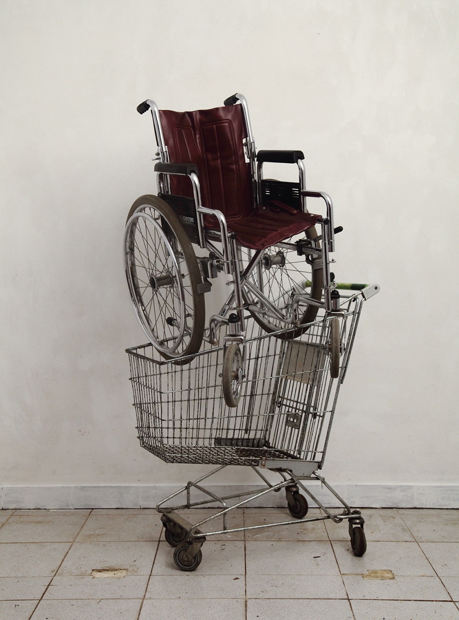 Wheelchair in supermarket cart